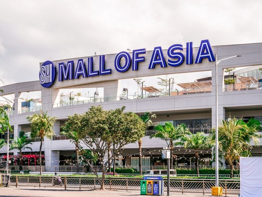 Exterior view of SM Mall of Asia, showcasing modern architecture and vibrant atmosphere in Pasay City, Philippines. (Photo by Kimy Moto on Pexels)