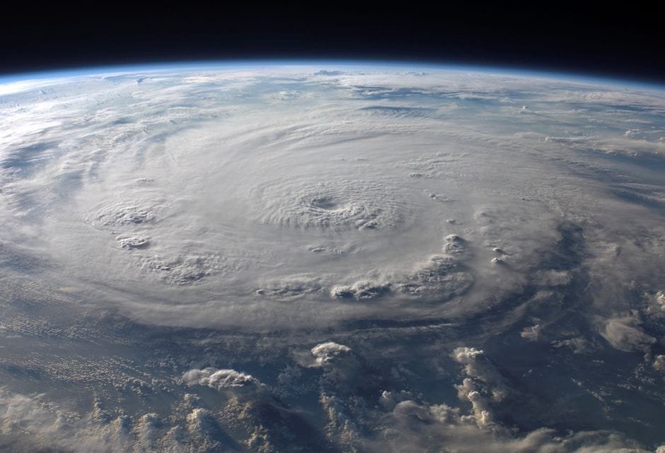 A stunning aerial view of Earth with a massive swirling hurricane, highlighting meteorological beauty. (Photo by Pixabay on Pexels)