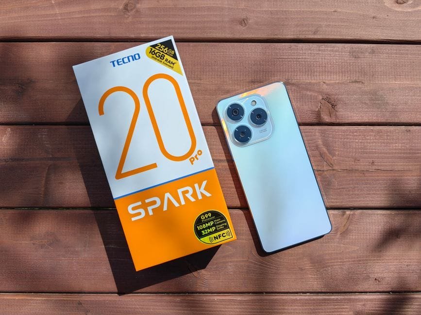 TECNO Spark 20 Pro with packaging on a wooden surface in natural light. (Photo by Andrey Matveev on Pexels)