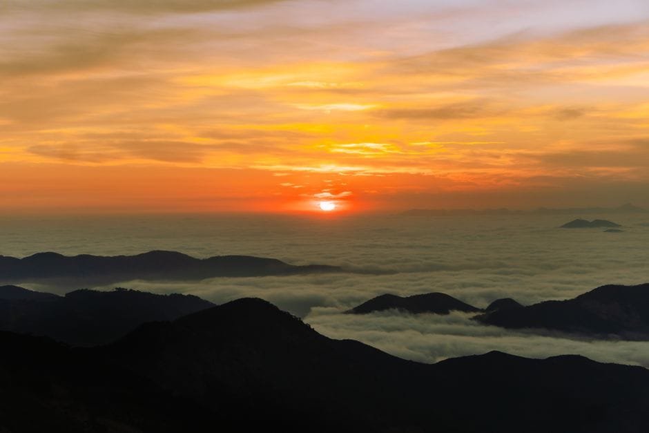 Capture of a stunning sunset over mountain peaks with clouds in Pinal de Amoles, Mexico. (Photo by Heber Vazquez on Pexels)