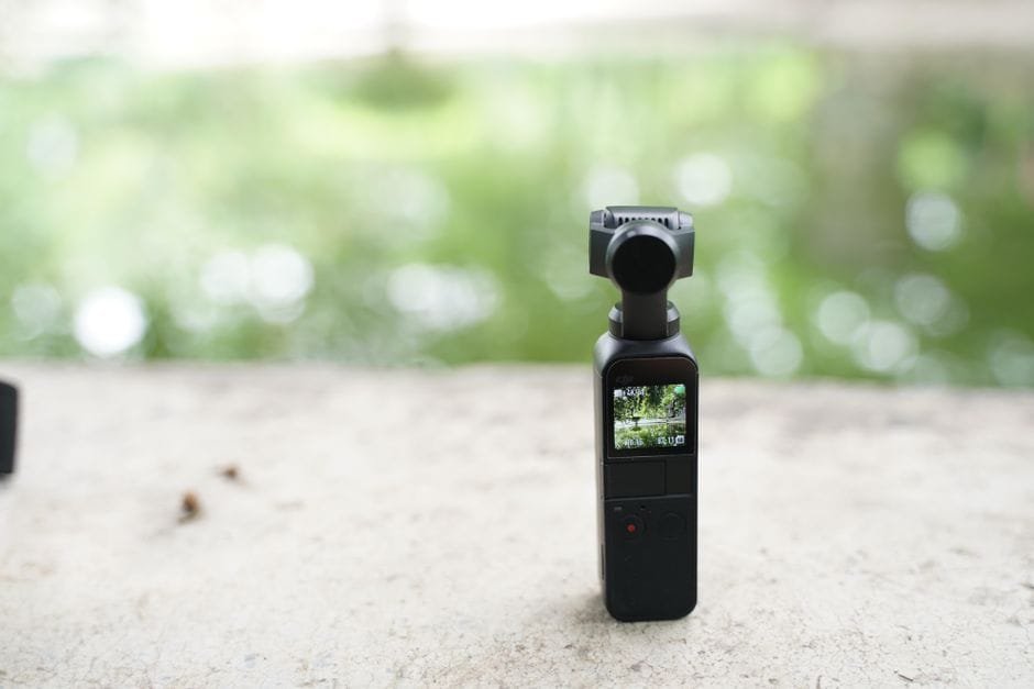 Compact wireless video camera with screen, placed outdoors with blurred natural background. (Photo by Sandeep Kashyap on Pexels)
