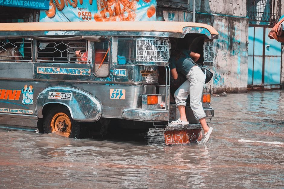 Jeepney navigating through a flooded street in Malabon, Metro Manila. (Photo by Tear Cordez on Pexels)