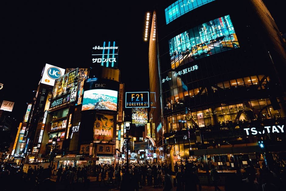 Explore the buzzing nightlife at Shibuya Crossing, Tokyo, with neon lights and bustling crowds. (Photo by Aleksandar Pasaric on Pexels)