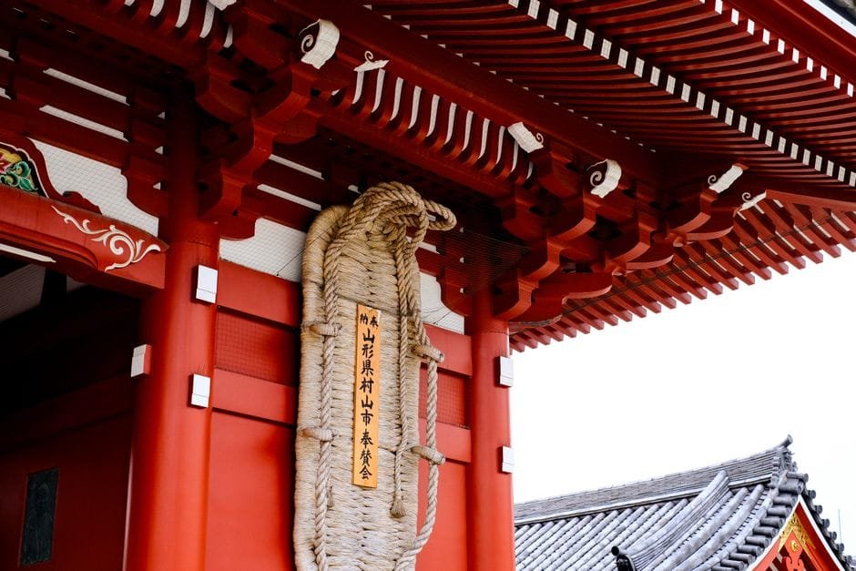 Close-up of Sensoji Temple's ornate red architecture in Tokyo, Japan. (Photo by Vinny Anugraha on Pexels)