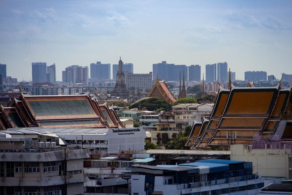Skyline view of Bangkok highlighting traditional Thai architecture amidst modern buildings. (Photo by Zaonar Saizainalin on Pexels)