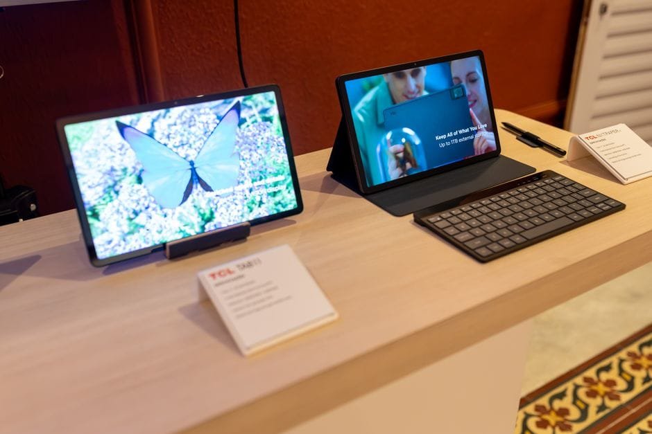 Two sleek tablets showcased with a keyboard in a technology showroom, highlighting wireless connectivity. (Photo by Matheus Bertelli on Pexels)