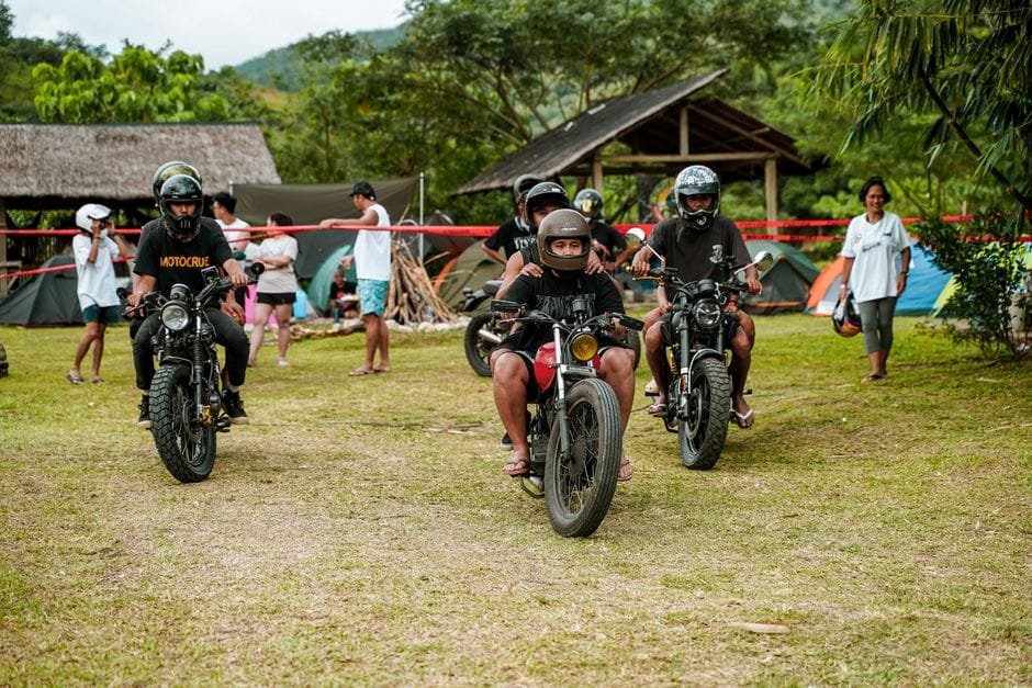 A group of motorbikers gathering in an outdoor campsite in Tanay, Philippines. (Photo by Harvey Tan Villarino on Pexels)