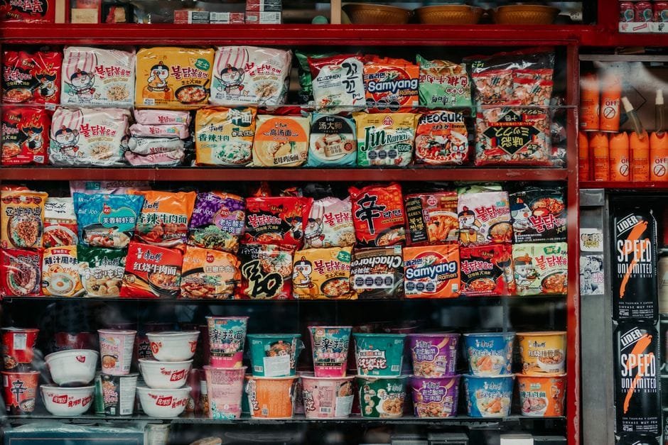 Display of assorted instant noodles and snacks at a market in Buenos Aires, Argentina. (Photo by Gera Cejas on Pexels)