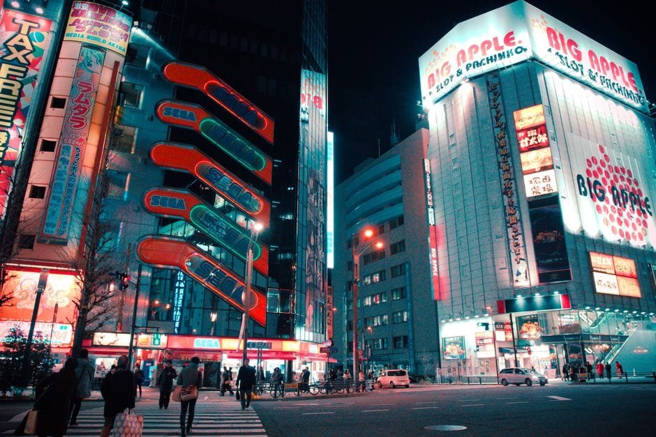 Explore the bustling streets of Akihabara, Tokyo, with glowing neon signs and lively crowds at night. (Photo by Dex Planet on Pexels)